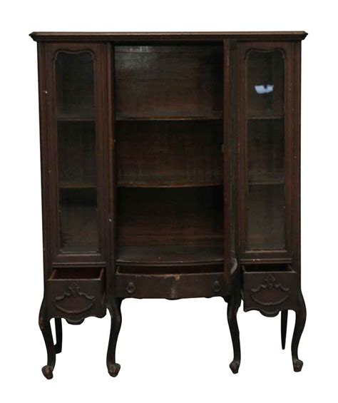 Go for an updated traditional look in wood or try our contemporary curio cabinets for a more cutting edge feel. Antique Curved Leg Wooden Curio Cabinet | Olde Good Things