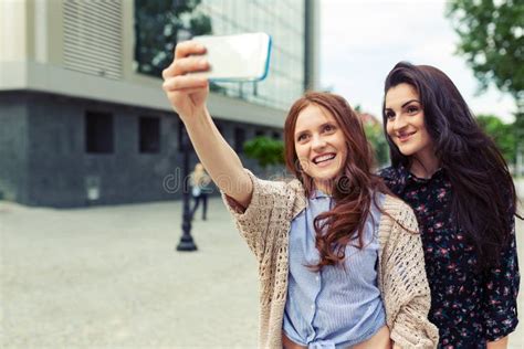 Two Girls Making Funny Selfie On The Street Having Fun Together Stock Image Image Of Memories