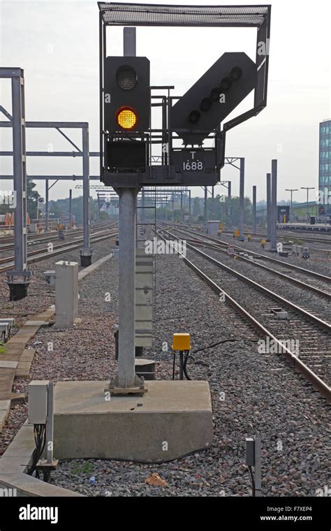 A New Led Train Signal Displaying A Yellow Proceed Aspect Along The