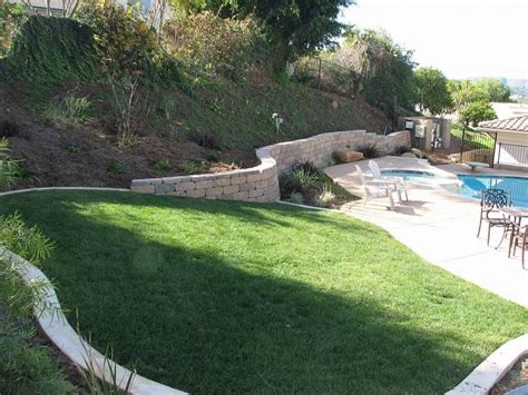 Side view from basin a month later with lilies integrated into the natural landscape. sloped backyard landscaping designs with small pool - Home ...