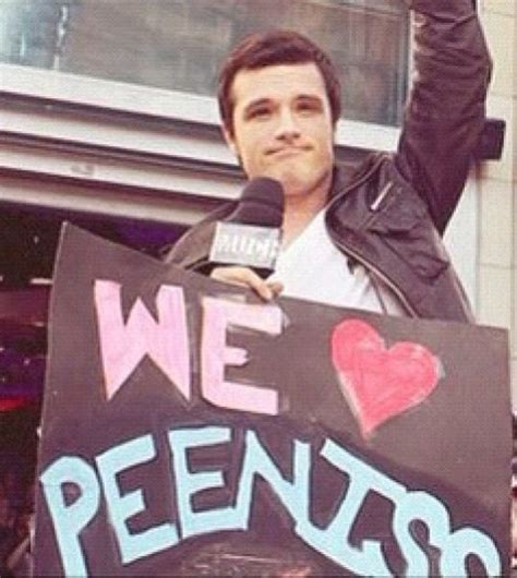 Josh Hutcherson Posing With A Sign Of Their Couple Name Hunger Games