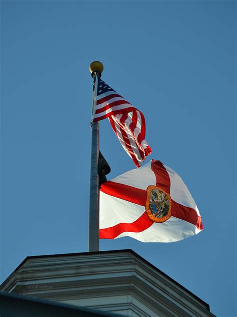 United States And State Of Florida Flags Over The State Capitol