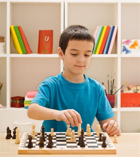 A Boy Playing Chess Stock Photo Image Of Playing Looking 15359584