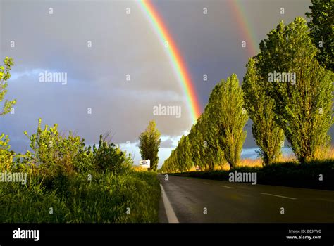 Rainbow On The Road Stock Photo Alamy