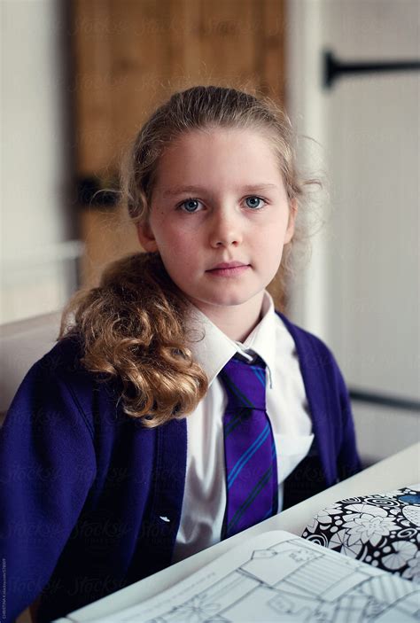 Schoolgirl Sitting At The Table After School By Stocksy Contributor Christina K Stocksy