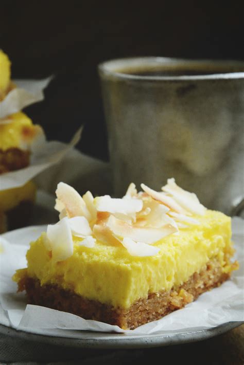 Grease an 8x 8 baking pan and line it with a strip of parchment paper. Low-Carb Coconut Lemon Bars Recipe - Simply So Healthy