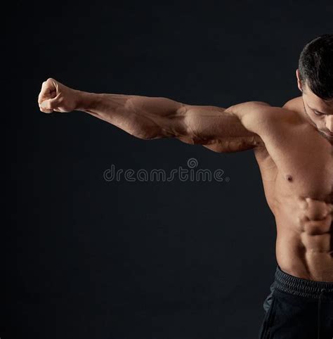 Strong Sportsman Demonstrating His Arm Muscles Stock Image Image Of