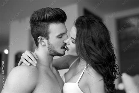 Foto De Sexy Couple Kissing At Home Black And White Do Stock Adobe Stock