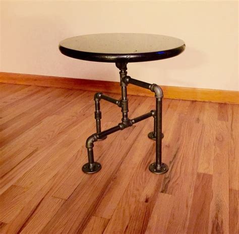 The table features a rustic design and utilizes four lengths of pipe, mounted to the boards using the flange fitting, in order to create the different levels. Industrial Black Pipe Table, End Table, Man Cave Table ...