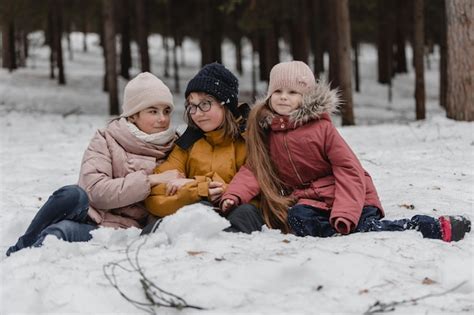 Premium Photo Kids Playing In Snow Children Play Outdoors In Winter