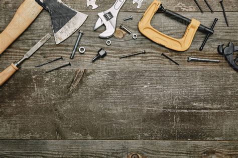 Top View Of Different Carpentry Tools On Wooden Background Stock