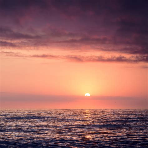 mx95-sunset-sea-beach-sky-shine-wallpaper
