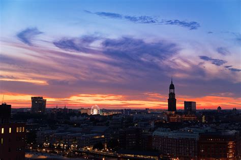 View Of Hamburgs Landmarks At Sunset Dancing Towers Ferris Wheel And St