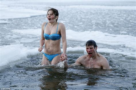 Orthodox Christians Take A Dip In Icy Rivers Across Europe For Epiphany