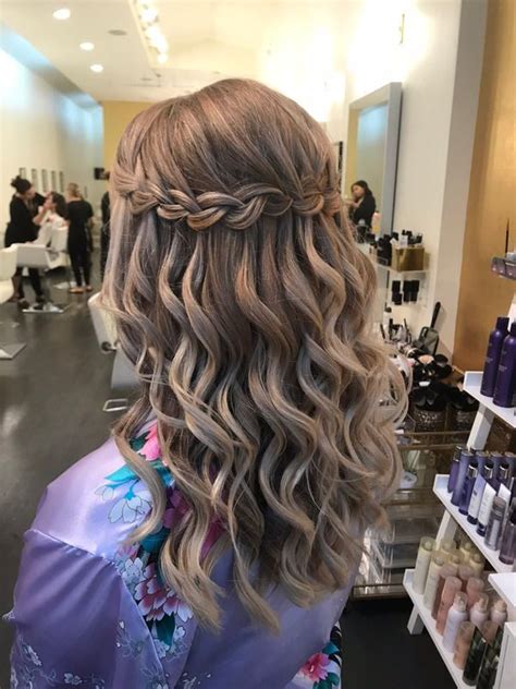 Braided styles have existed in the fashion world long before we can even remember and it seems that they are here to stay. this waterfall braid with soft waves is the perfect ...