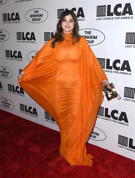 Donna D Errico Sizzles In See Through Orange Dress As She Shows
