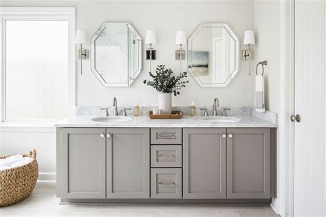 The elegant bathroom features a black floating vanity, white countertop, vessel sink, gold accents, and gray marble tiles. Bathroom Backsplash Ideas: 10+ Stunning Designs for Your ...