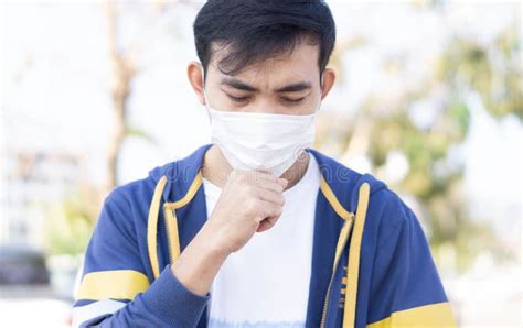 Closeup Man Wearing Face Mask For Protect Air Pollution Or Colona Virus