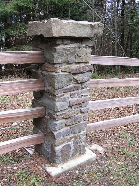 The main gate is also done in a simple fashion, horizontal rails with a . This stone column is part of a split rail fence that ...