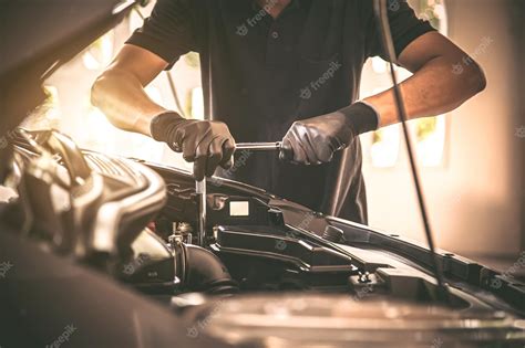 Premium Photo Closeup Hand Auto Mechanic Using The Wrench To