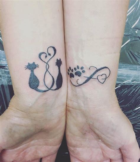 Gorgeous Two Sweet Little Cat Tattoos On Wrist Blurmark