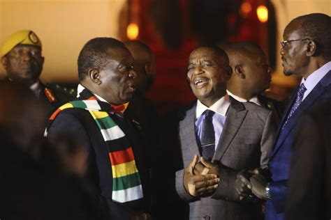 Zimbabwes President Returns Amid Economic Crisis Crackdown Ap News