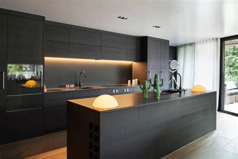 Blacks, white and grays are popular cabinet colors in a contemporary design. 40 Sleek Black Kitchen Ideas and Cabinets (2020 Photos)