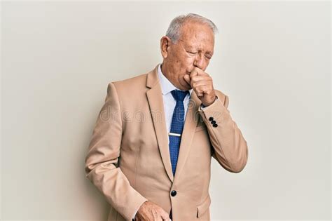 Senior Caucasian Man Wearing Business Suit Feeling Unwell And Coughing