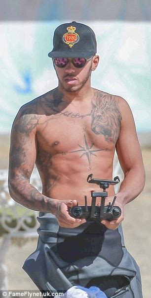 Voor lewis hamilton zijn alle tatoeages dierbaar, omdat ze direct zijn verbonden met zijn levensloop tot nu toe. Shirtless Lewis Hamilton shows off muscular upper body in ...
