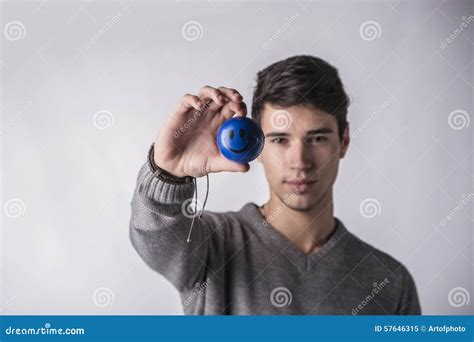 Handsome Young Man Holding Small Ball With Smiley Stock Image Image