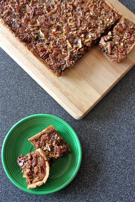 Classic southern pecan pie bars with a touch of cocoa in the crust, a layer of melted chocolate, salted and roasted pecans, and a splash of bourbon in the filling. Baked Perfection: Chocolate Pecan Pie Bars