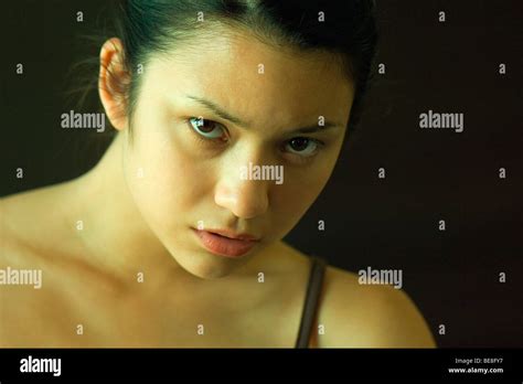 Woman With Head Down Looking Up At Camera Stock Photo Alamy