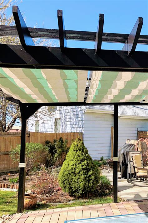 Striped Fabric Retractable Awnings On Backyard Pergola Patio Shade
