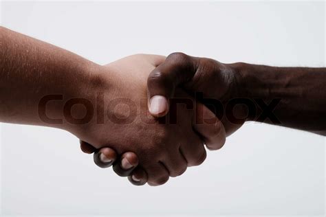 African American Businessman Shaking Hands With Caucasian Businessman