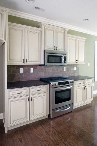 Distressed kitchen cabinets kitchen cabinets pictures country kitchen cabinets country kitchen designs french country kitchens painting kitchen hgtv has inspirational pictures, ideas and expert tips on distressed kitchen cabinets to help you achieve the look of another place and time. distressed white kitchen cabinets | Heritage Cabinet ...