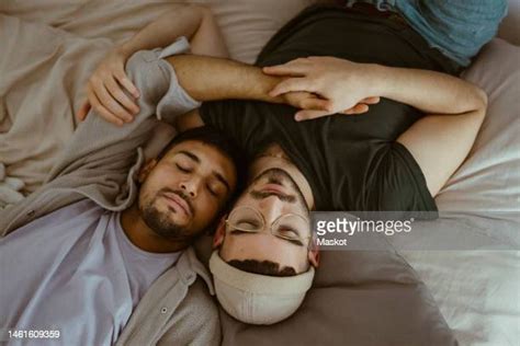 gay couple sleeping photos and premium high res pictures getty images