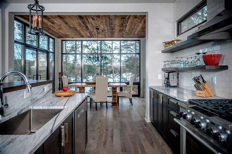 We can't share all the sources, but trust us—we share and give as much as we can! Black Kitchen Cabinets Hickory Wood Floors - Contemporary ...