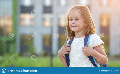 Happy Girl With Backpack Goes To School For First Time Stock Image