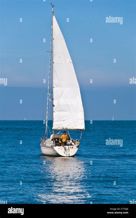 A Single Mast Boat Sailing Forward To The Sea Stock Photo Alamy