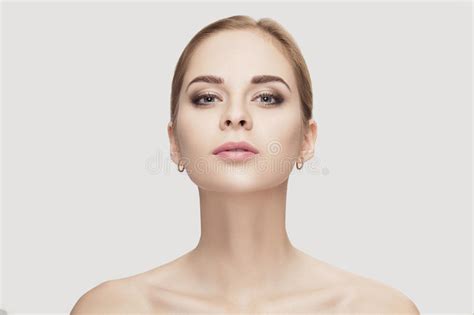 Front Portrait Of Female Neck On Grey Background Close Up Girl With Clean And Lifted Skin Stock