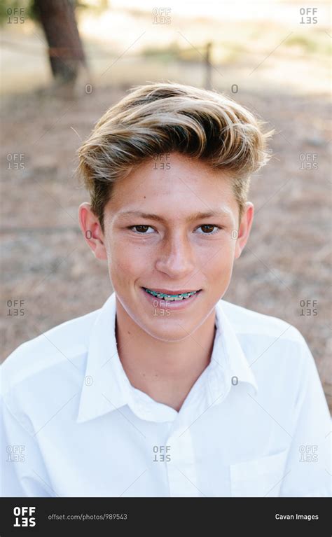 Portrait Of A Handsome Teen Boy With Brown Eyes And Braces Stock Photo