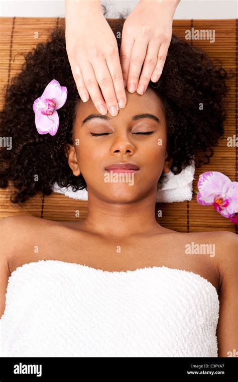 Brazilian Woman At Day Spa Laying On Bamboo Massage Table With Head On