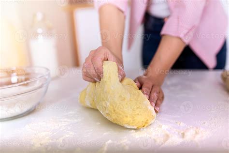 Close Up Of Female Baker Hands Kneading Dough And Making Bread Cooking