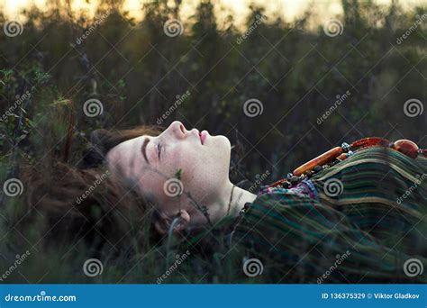 Portrait Of Beautiful Hippie Girl Lying On The Grass Stock Image