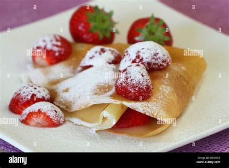 Crepe With Strawberries Dusted With Icing Sugar Stock Photo Alamy