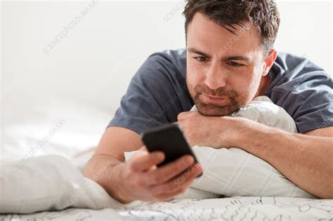 Man Lying Down Using Smartphone Stock Image F0178630 Science
