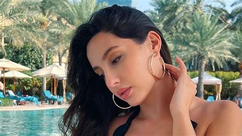 nora fatehi takes a dip in the pool in sexy black swimsuit internet is on fire india today