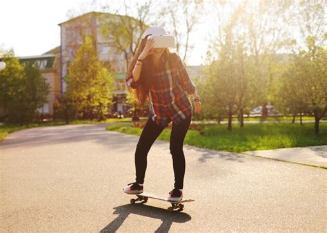 Premium Photo Young Girl Riding On A Skateboard In Glasses Virtual