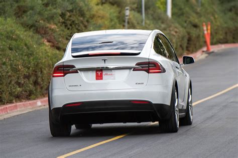 Tesla Suv Is So Fast It Beats A Supercar While Towing A Car Money