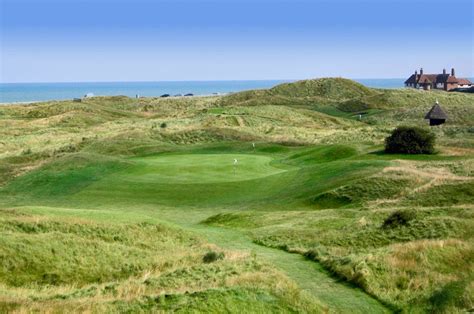 Drives which cannot crest a ridge that bisects the hole are gathered into two bunkers at the corner of the right angled fairway. Royal St George's Golf Club, Sandwich, United Kingdom ...